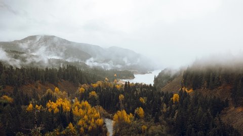 Clouds and Fog rolling through a Forested Mountain Valley with lake and River Time Lapse (4K)