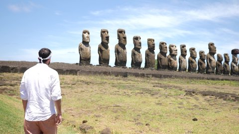 Easter Island, Chile - Nov 1 21: Moai statues in Ahu Tongariki. Statues of Easter Island in Chile. Mysterious Giant megalith Moai statues. Stunning shot of mysterious monoliths on a perfect sunny day.