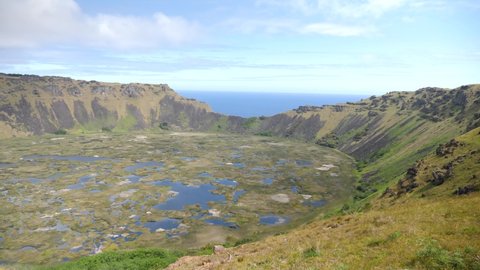 A large volcanic crater on Easter Island. Rano Kau crater. Orongo Crater from ridge in Easter Island, Chile. A crater on exotic volcanic island, Rapa Nui.