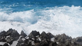 Waves breaking over dangerous rocks, Sea storm concept, Ocean waves crash on the rocks, Creating an explosion of water in 4k