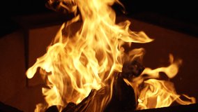 Live, hot flames curl out of the fire pit in the cold of the night - slow motion - Powered by Shutterstock - Get 15% off with code: PIKWIZARD15