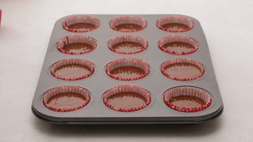 Chocolate cupcakes or chocolate muffins step by step recipe. Baking process, close up video, woman hands
