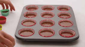 Chocolate cupcakes or chocolate muffins step by step recipe. Baking process, close up video, woman hands
