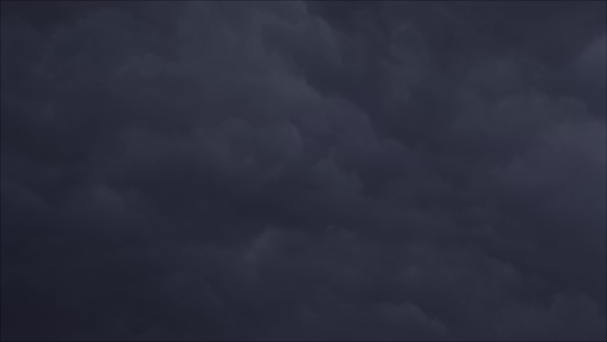 Lightninig and Cloud. Many lightnings bolts in the black sky illuminate the clouds randomly.
 