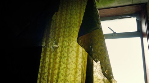 Run Down House With Old Curtain By Window