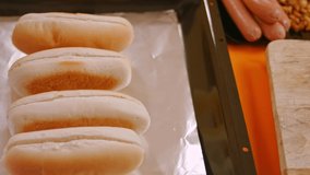 I add mustard to the hot dog. 4k video