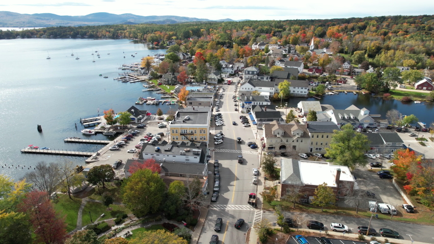 Town of Wolfeboro, New Hampshire USA. Aerial View, Downtown Street and Buildings by Lake Winnipesaukee on Sunny Autumn Day, Drone Shot