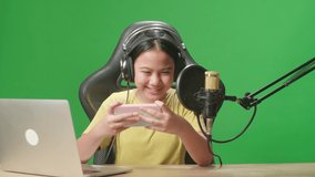Asian Kid Girl Playing Video Game With Mobile Phone Then Lose The Game While Live Stream On Green Screen 
