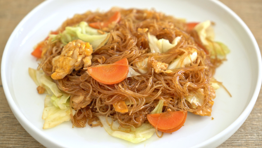 stir fried vermicelli with cabbage, carrot and egg - vegan food style