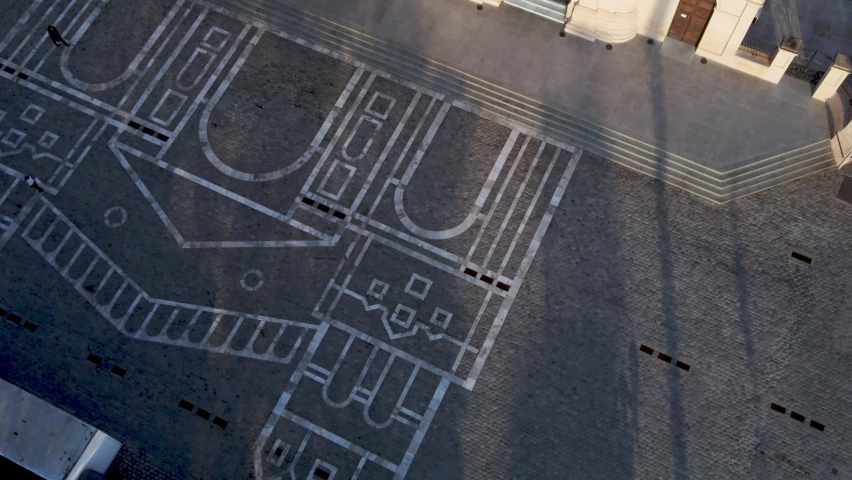 Aerial view of the Cathedral of Cordoba and painting on the ground in front of the church. Top down view