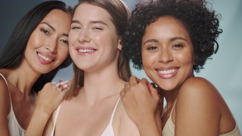 Beauty Portrait of Three Diverse Multiethnic Models on Isolated Background. Beautiful Happy Asian, Black and Caucasian Women with Natural, Healthy Skin. Wellness, Spa, Cosmetology, Skincare Concept.