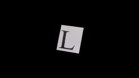 4K Stop Motion - paper with letter L moving on black png background. More elements in our portfolio.