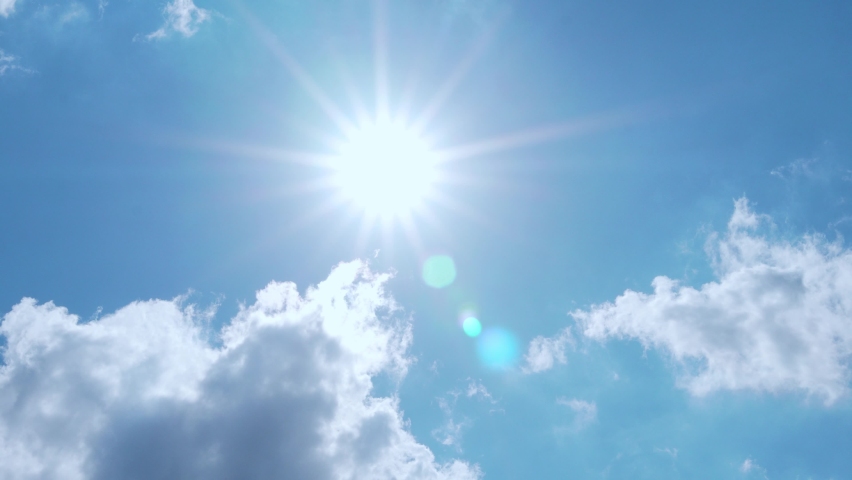 Sun With Rays and Glare, Blue Clear Sky and Clouds, Slow Motion, Time Lapse. Sunlight in an Azure Sky with Cumulus White Clouds in Sunny Bright Weather. Natural Background 4K. | Shutterstock HD Video #1082083205