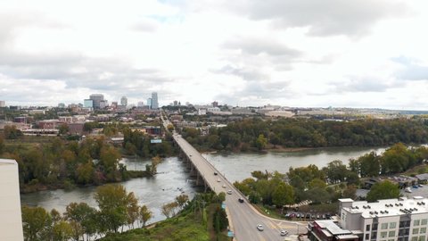 An aerial of Columbia, South Carolina from the River District revealing the Congaree River and Skyline in the fall.