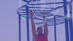 Animation of rotating scanner and processing data over male athlete exercising on monkey bars. sport, achievement and communication technology concept, digitally generated video.