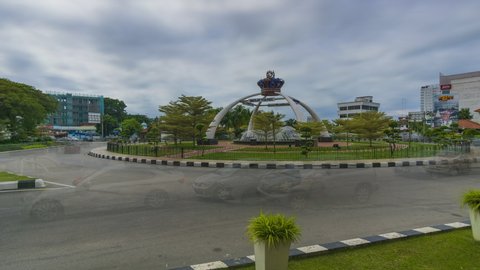 MUAR , JOHOR, MALAYSIA - 10 NOVEMBER 2021 : TimeLapse view of replica of the giant Johore Royal Crown at the roundabout Jalan Sulaiman Muar. Sunny day in the morning. Clear blue sky
