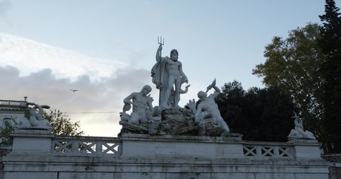 Fountain of Neptune in Piazza del Popolo in Rome before sunset. Slow motion 50fps 4k
