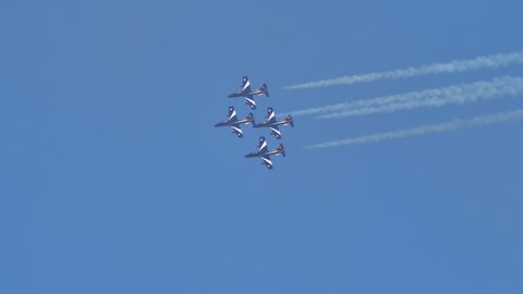 Thiene Vicenza Italy OCTOBER, 16, 2021 Diamond formation of 4 military aircraft flying in the blue sky with white trails. Aermacchi MB-339 of Frecce Tricolori Pattuglia Acrobatica Nazionale