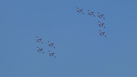 Thiene Vicenza Italy OCTOBER, 16, 2021 Complex teamwork reunion in flight between two military aerobatic teams in close formation in the blue sky. Aermacchi MB-339 of Frecce Tricolori