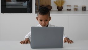 Little  Boy Study With Laptop At Home, Frowning While Looking At Screen, Small African American Male Child Suffering Problems With Distance Learning And Online Education, Slow Motion Footage