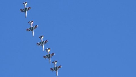 Thiene Vicenza Italy OCTOBER, 16, 2021 Military aerobatic aircraft quickly change formation in flight showing the great preparation of the pilots. Aermacchi MB-339 of Frecce Tricolori