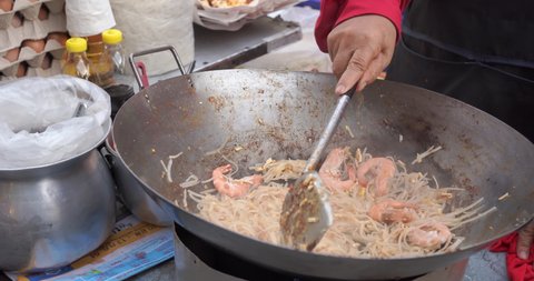 The best street food Pad thai favorite and famous Asian. Chef cooking Pad Thai food night market. 