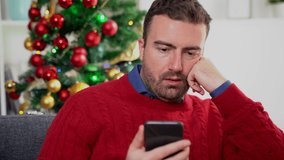 This video is about one bored man suffering Christmas stress holding phone