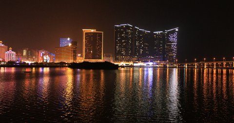Macau, China - December 9, 2016: Panorama of Macao in China with Wynn Macau, Casino Lisboa and Grand Lisboa hotel, popular casino from Nam Van Lake, a man-made lake in southern end Macau Peninsula.