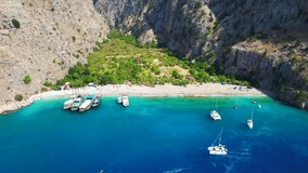Butterfly Valley (Turkish: Kelebekler Vadisi) in Fethiye. Aerial view of sea and beach of Butterfly Valley. Oludeniz - Fethiye, Mugla, Turkey. Aerial 4K drone shot.