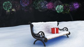 Animation of fireworks exploding over christmas presents on bench with snow. christmas, tradition and celebration concept digitally generated video.