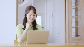 Asian business woman using a personal computer