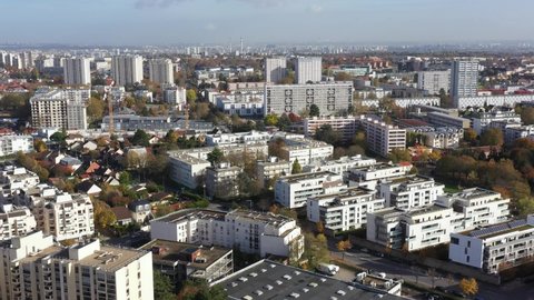 France, Paris suburb (Val-de-Marne district), Chevilly-Larue, HLM buildings and residential homes. Chimneys of the old thermal power station of Vitry-sur-Seine in the background, drone aerial view