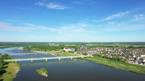 The Loire and the city of Sully sur Loire in Europe, in France, in the Center region, in the Loiret, in summer, on a sunny day.