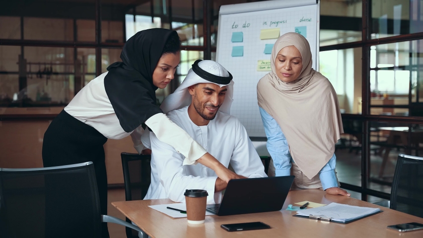 Cinematic footage of a multiethnic business group working together in an office of Dubai Royalty-Free Stock Footage #1082148647