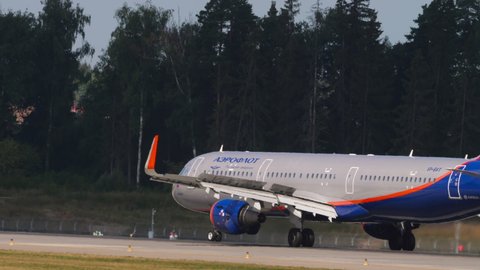 MOSCOW, RUSSIAN FEDERATION - JULY 30, 2021: Airbus 321-211, VP-BAY of Aeroflot braking after landing at Sheremetyevo Airport (SVO). Airplane arrival, rear view. Tourism and travel concept
