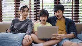 Family smiling talking at camera on laptop. Happy family speak talk on video call from home.