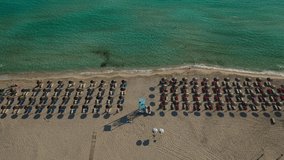 Aerial drone video from paradise organised sandy beach in Mediterranean destination island