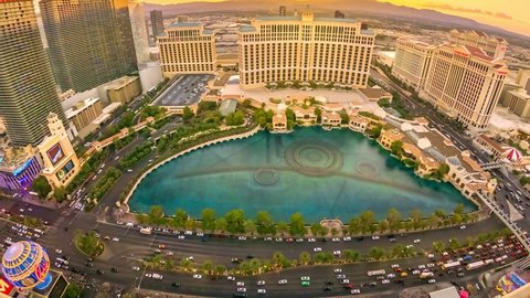 Las Vegas, Nevada, United States - August 18, 2018: TIME-LAPSE of Bellagio Casino dancing fountains night show from Eiffel Tower of Parisian luxury Resort Hotel Casino in Las Vegas Strip.