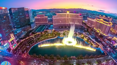 Las Vegas, Nevada, United States - August 18, 2018: TIME-LAPSE of Bellagio Casino dancing fountains night show from Eiffel Tower of Parisian luxury Resort Hotel Casino in Las Vegas Strip.