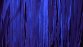 White ribbons sway in the wind in blue neon light on a dark night, nightclub decorations, abstract background, modern art, installation, bright neon light, beautiful texture, 4K video - Powered by Shutterstock - Get 15% off with code: PIKWIZARD15