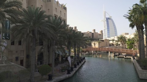 DUBAI, UNITED ARAB EMIRATES - MARCH 2021: Burj Al Arab hotel, one of the most recognizable landmarks of Dubai seen from the Souk Madinat Jumeirah.