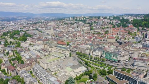 Lausanne, Switzerland. Flight over the central part of the city, Aerial View Hyperlapse, Departure of the camera