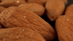 Heap of almond fruit close-up. Production of almond milk. The concept of vegetarian cuisine. Nuts, seeds. High quality. 4k footage.