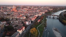 Drone view of the medieval city of Pavia in Italy : flyng over Ticino river and Old Town