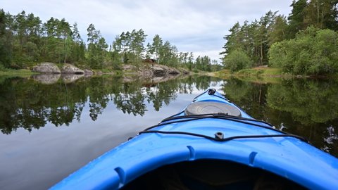 Beautiful Scandinavian landscape from a kayak paddling through a lake in Norway