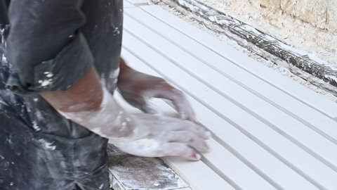 Lahore, Punjab, Pakistan, November 11, 2021. A worker making White Gypsum Ceiling Tile