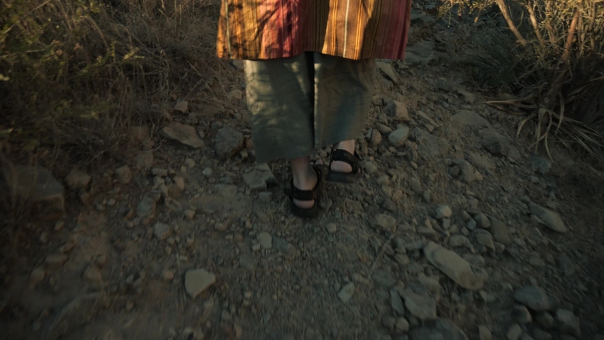 Feet of a Bible prophet or holy man walking in the desert | Shutterstock HD Video #1082208527