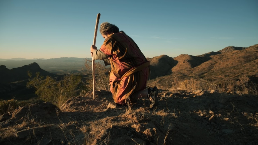 A Bible holy man or prophet kneeling in prayer | Shutterstock HD Video #1082208548