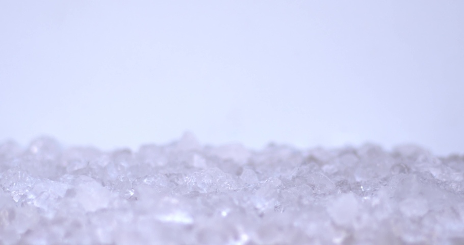 Slow motion of ice cubes falling in sliced pear, fresh fruits for juicy, cold, white food for summer time. Filmed on high speed cinema camera, 8K downscale, 4K.