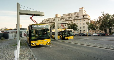 Berlin, Germany - 2021 12 10 - Electric busses charging at busy bus hub. Public transport with environmental friendly vehicles